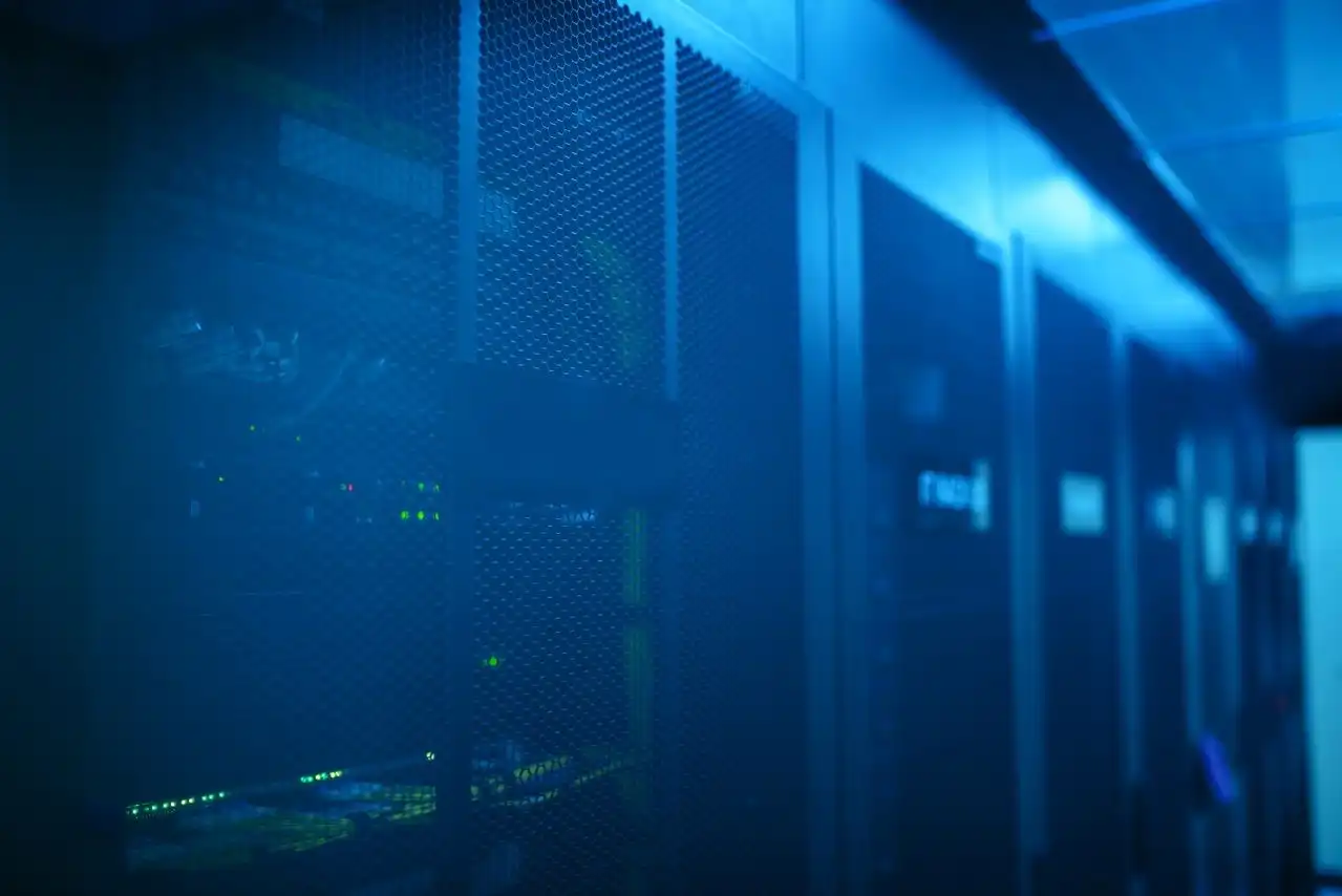 A modern server room featuring network equipment with blue illumination. Ideal for technology themes.